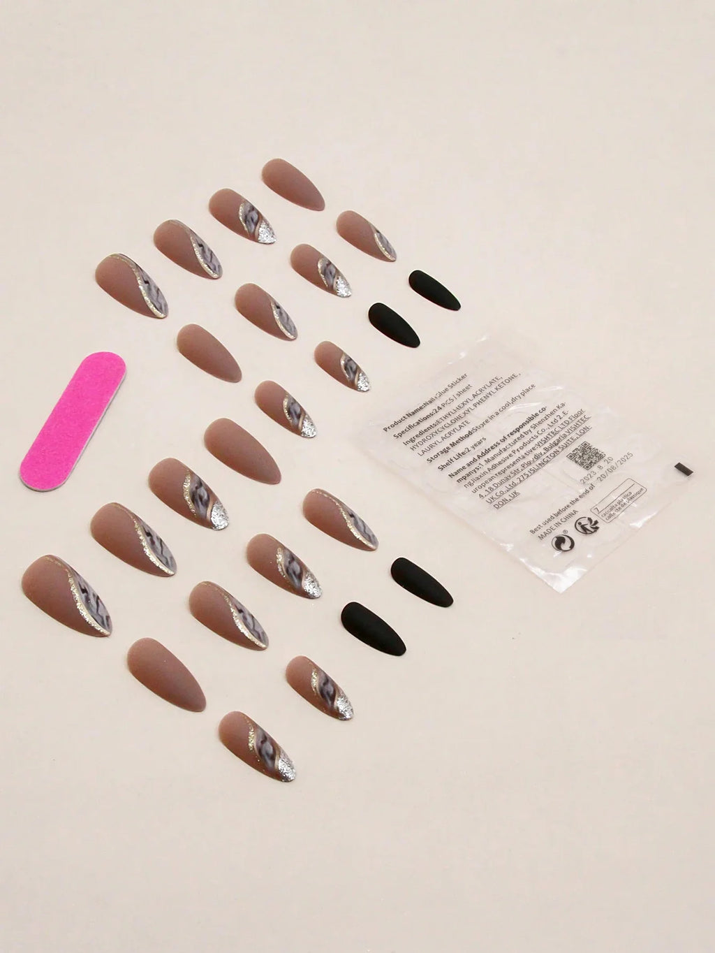 Set of nail art stickers with a variety of designs on a beige background