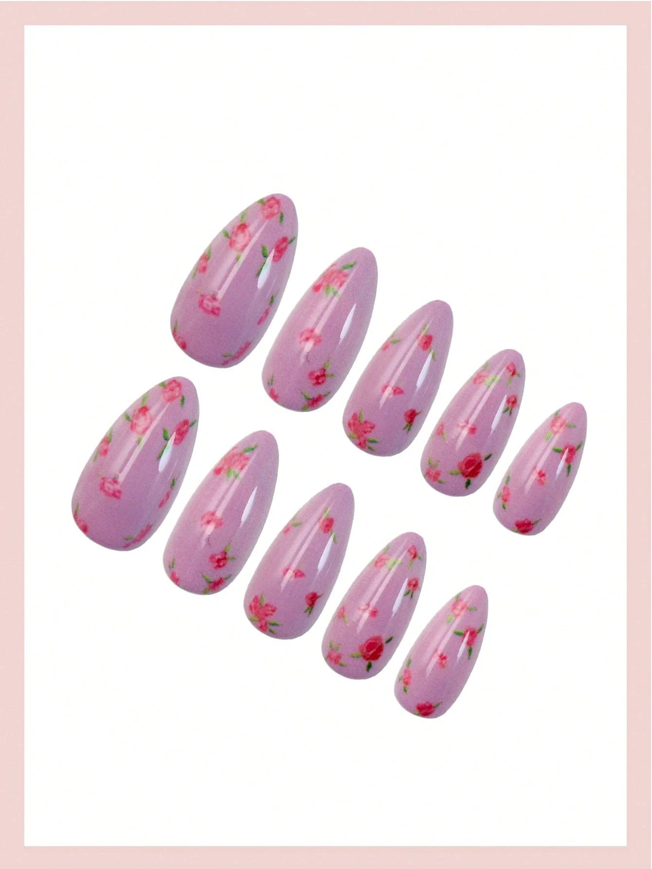 Pink nail art design with floral patterns on a white background