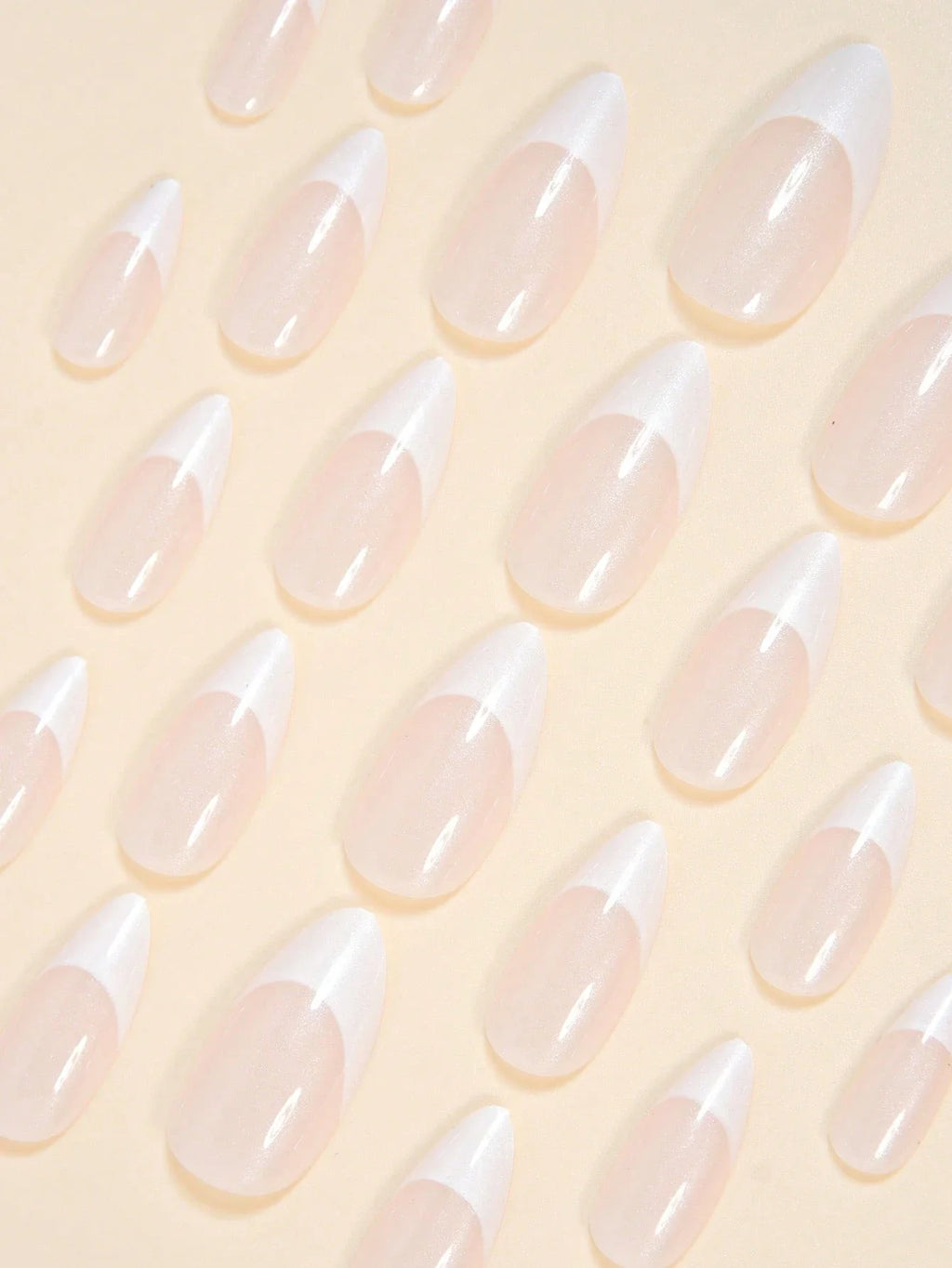 Translucent nail tips on a light yellow background