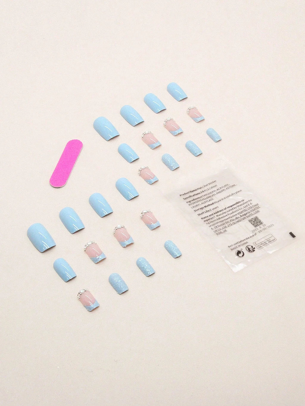 Set of pastel-colored nail polish samples on a light background
