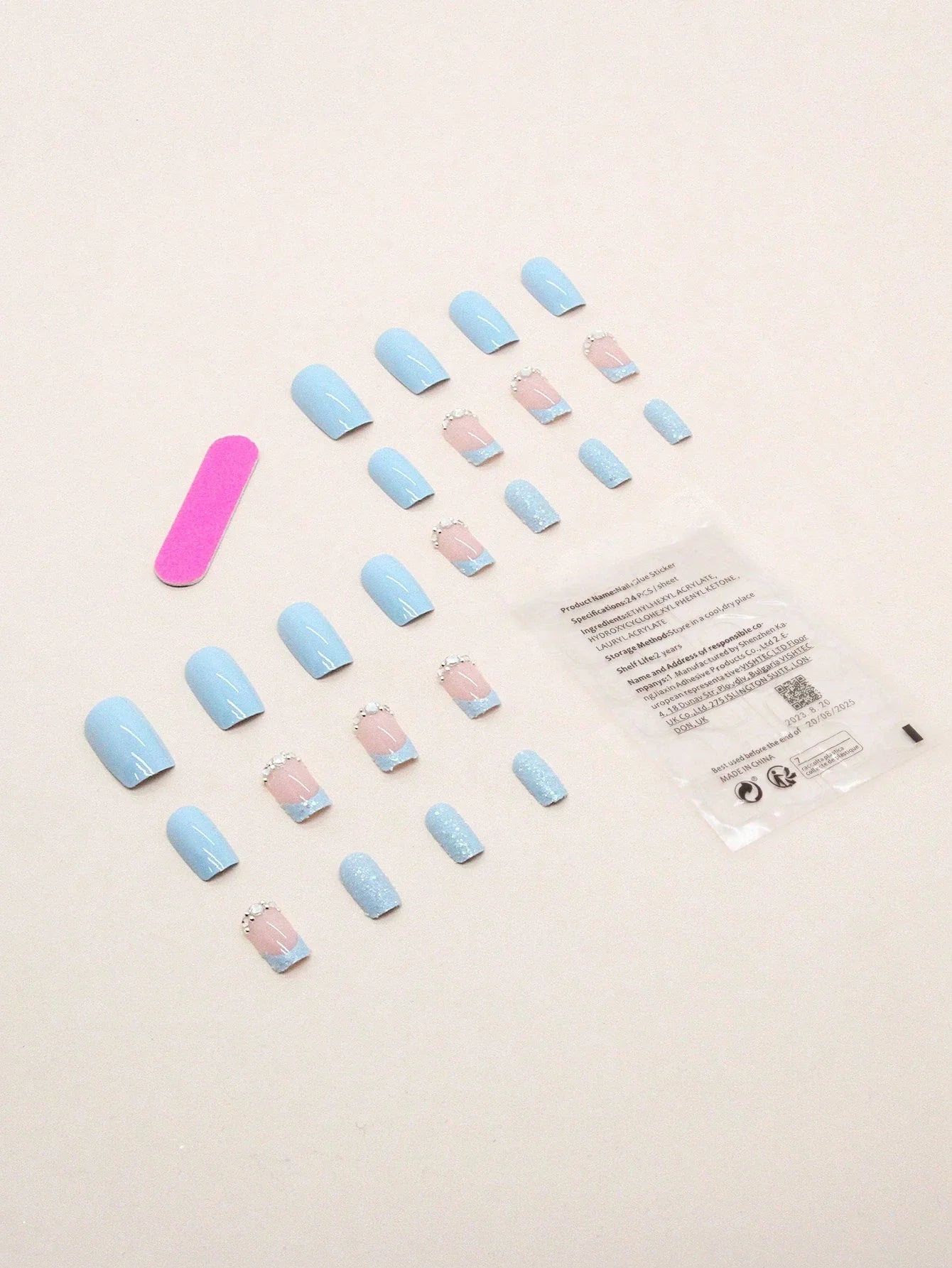 Set of pastel-colored nail polish samples on a light background
