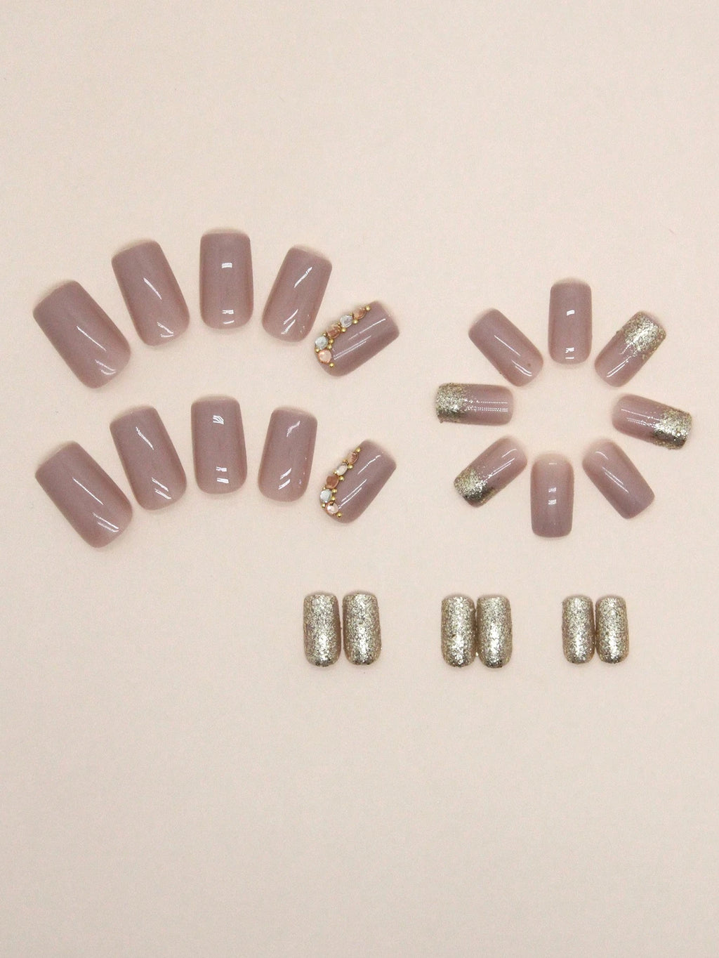 Set of pink and gold nail art designs on a beige background