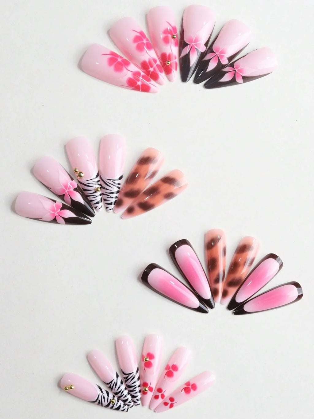 Set of nail art designs arranged in a circular pattern on a light background