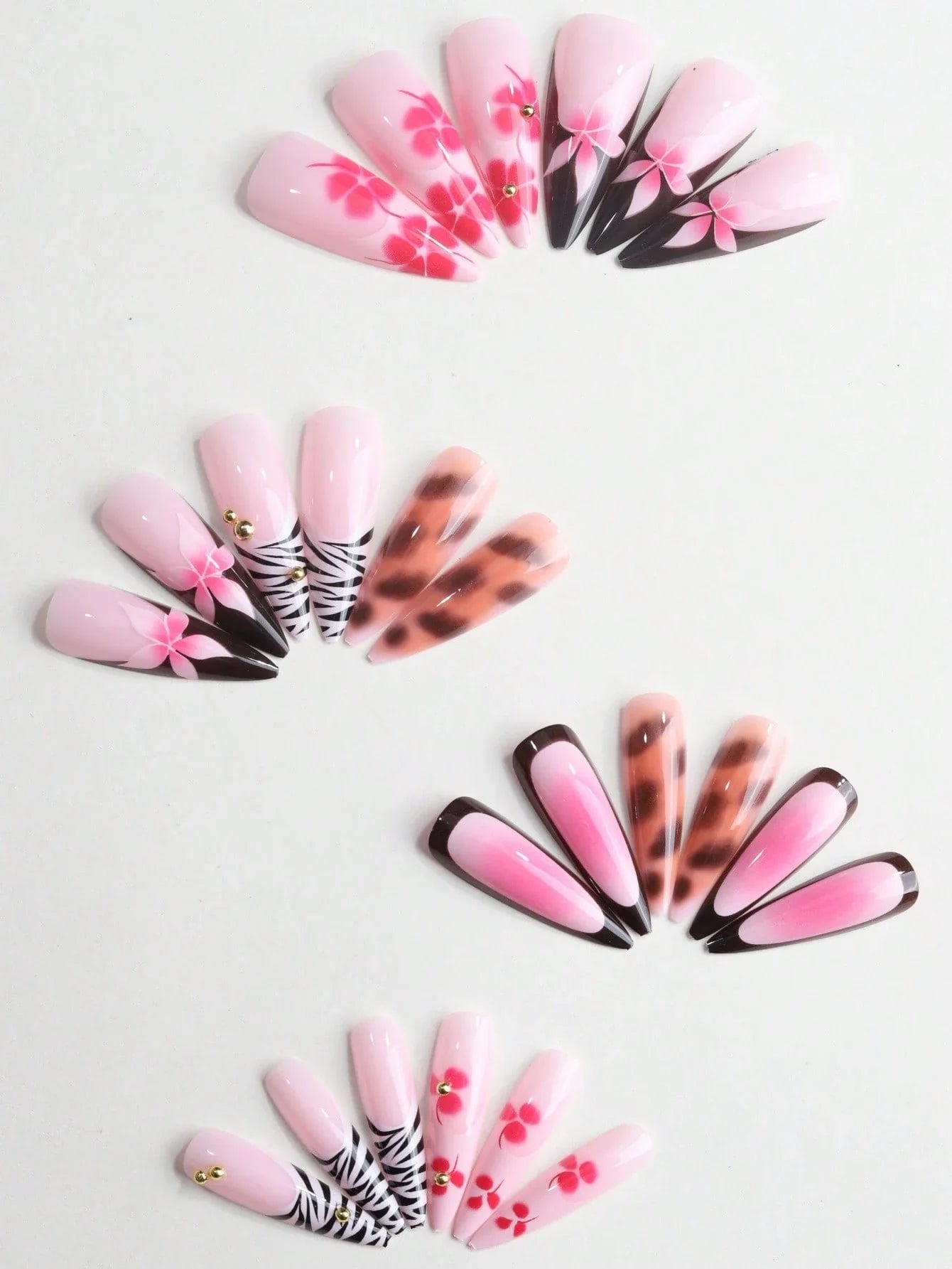 Set of nail art designs arranged in a circular pattern on a light background