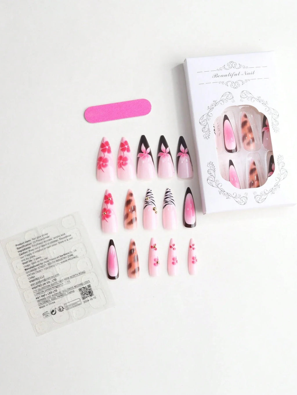Set of false nails with various designs on a white background