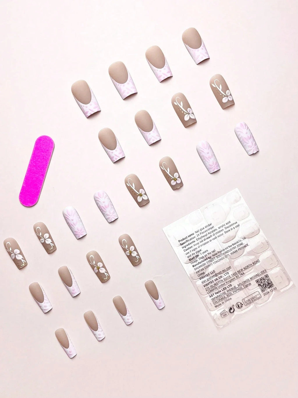 Set of false nails with a pink nail file and packaging on a light background