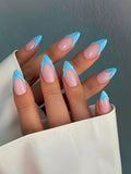 Nails with pink and blue design held by a person against a neutral background