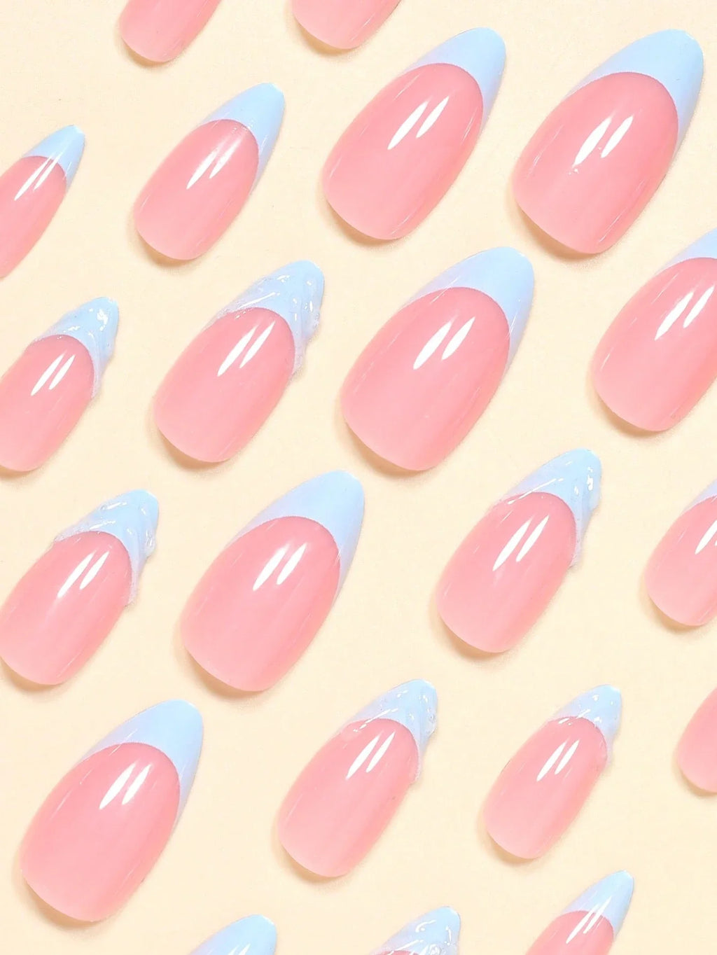 Pattern of pink and blue nail tips on a yellow background