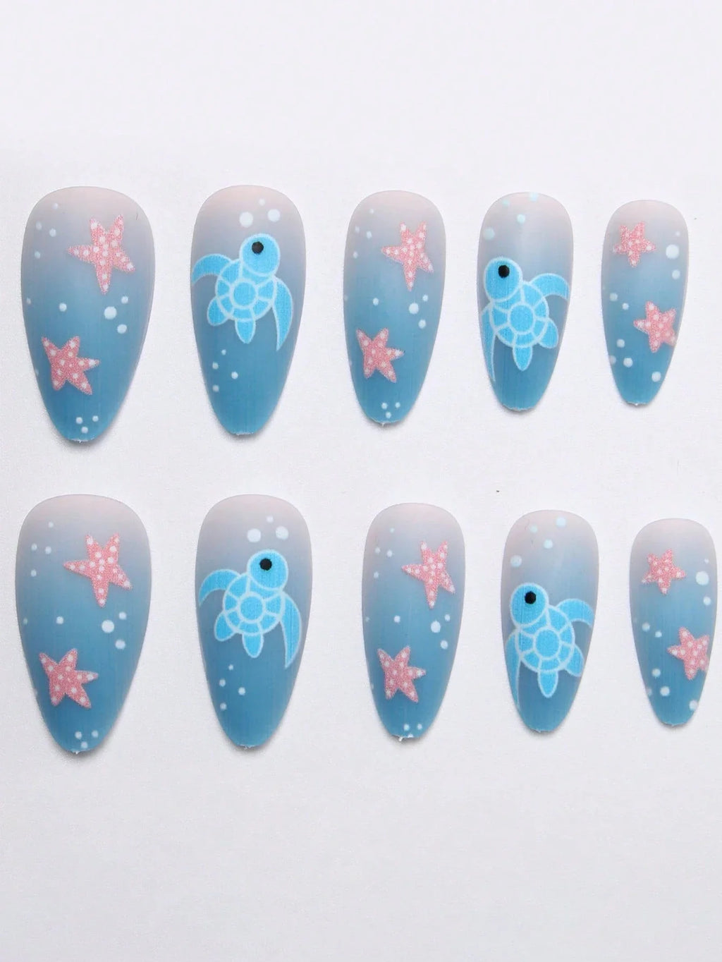 Nail art design with blue turtles and pink starfish on a gradient background