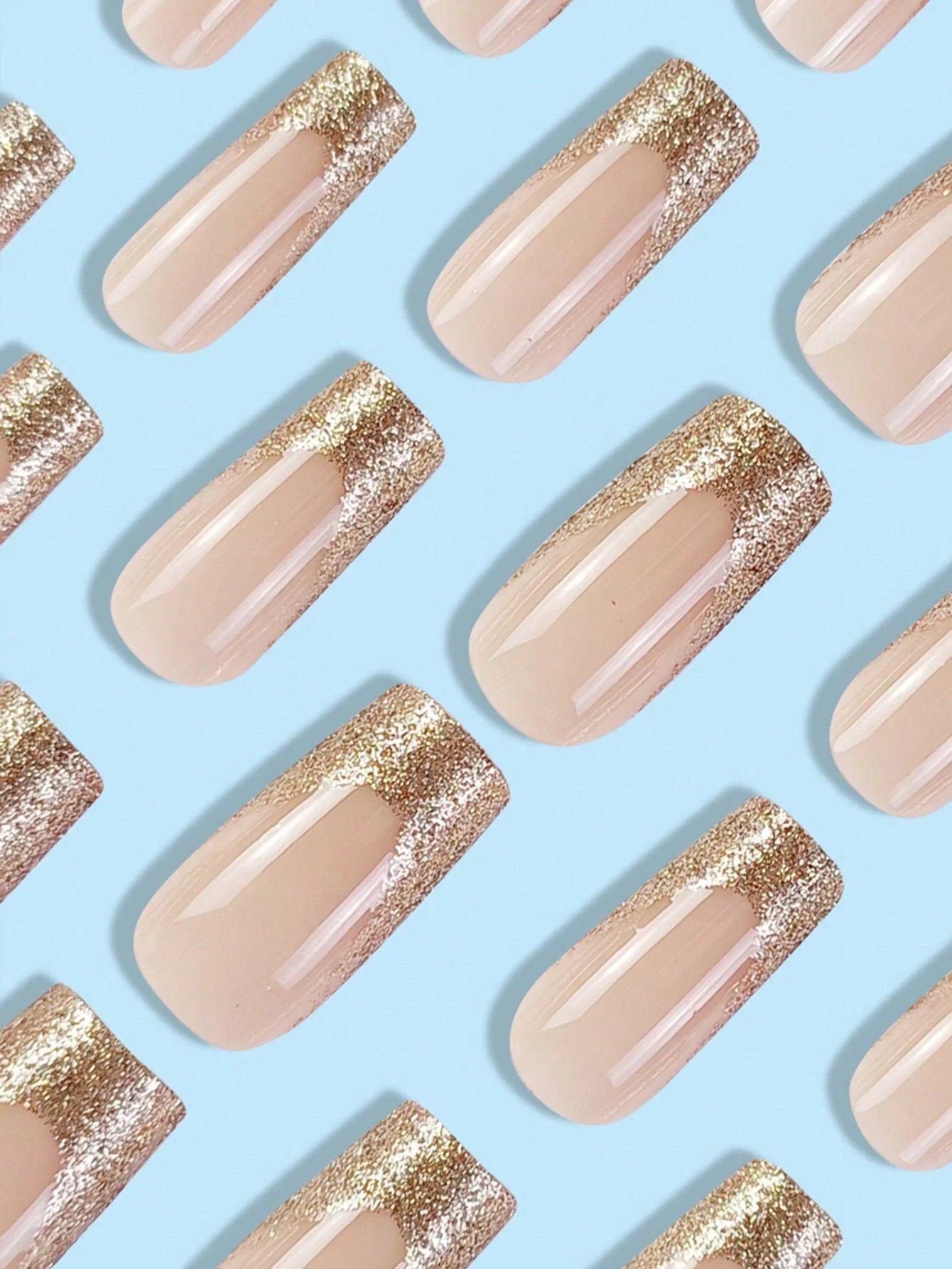 Pattern of beige nails with gold glitter on a light blue background