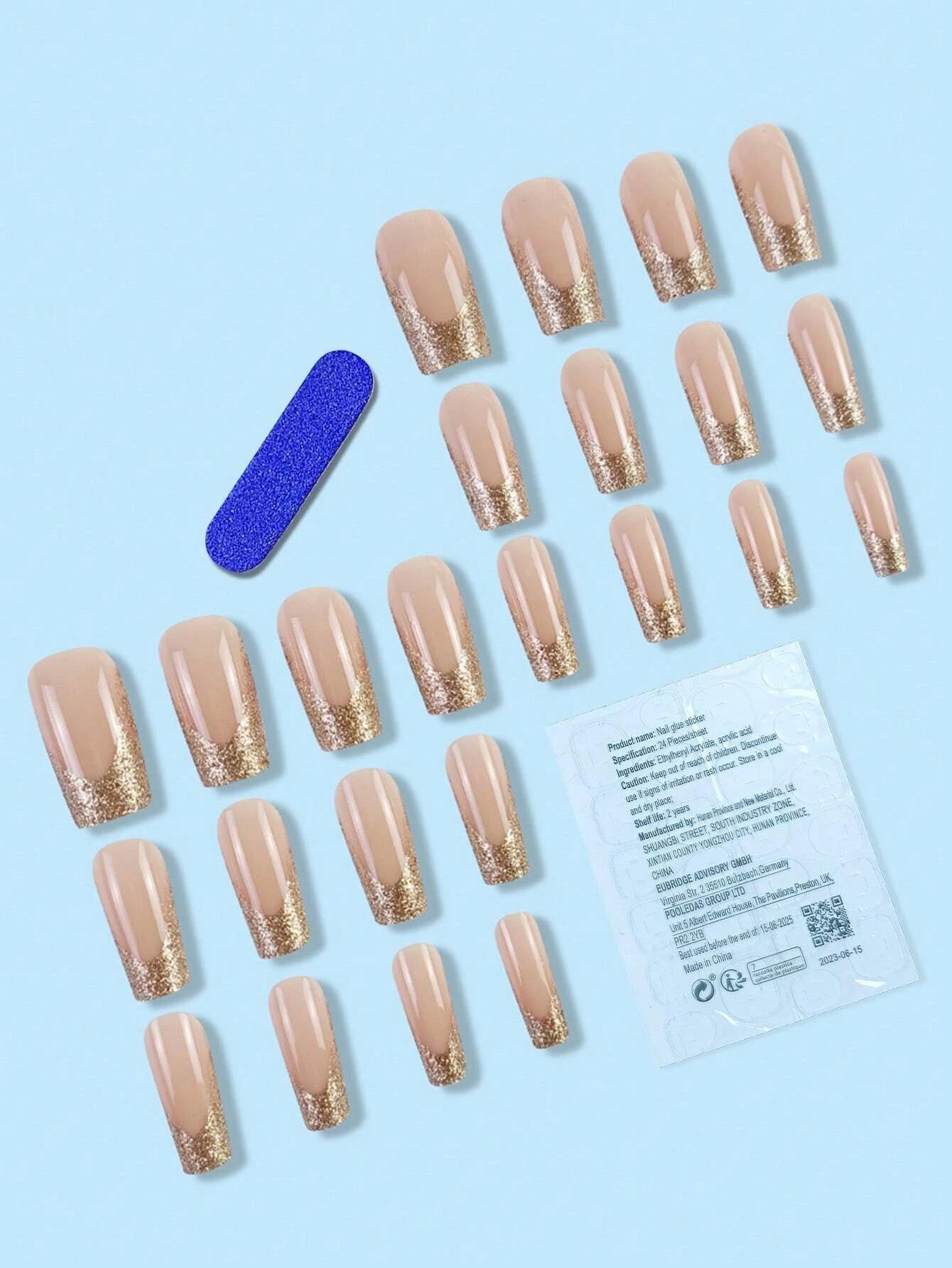 Set of beige press-on nails with gold glitter tips and a blue nail file on a light blue background.
