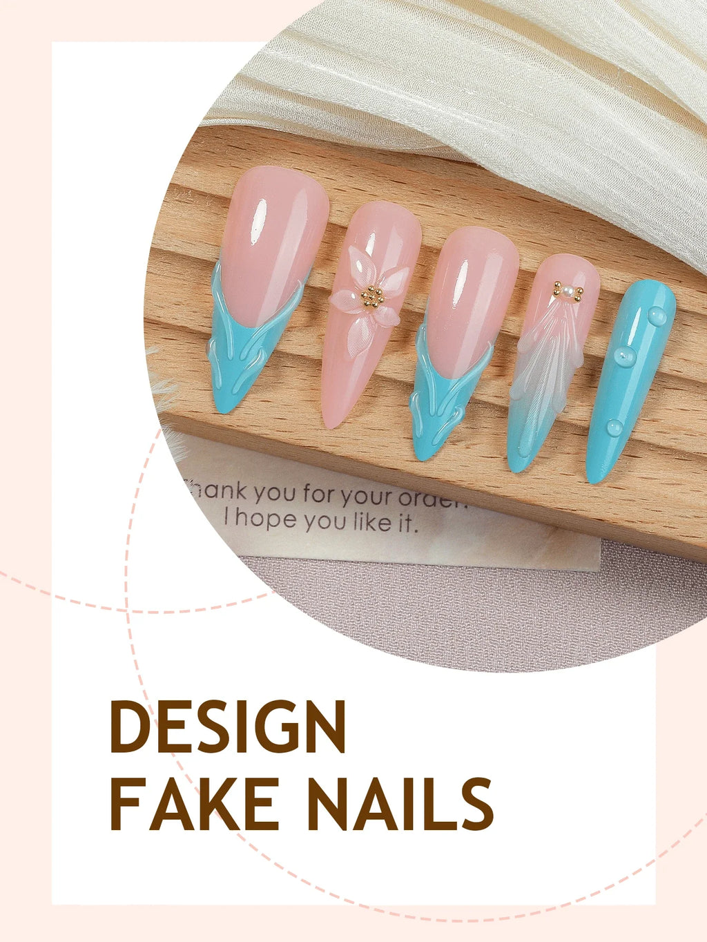 Design fake nails with pink and blue design on a wooden board.